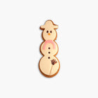 Speculaas snowman covered with marzipan and chocolate broom