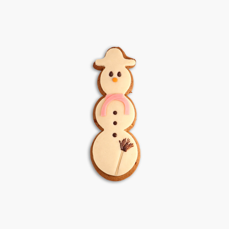 Speculaas snowman covered with marzipan and chocolate broom